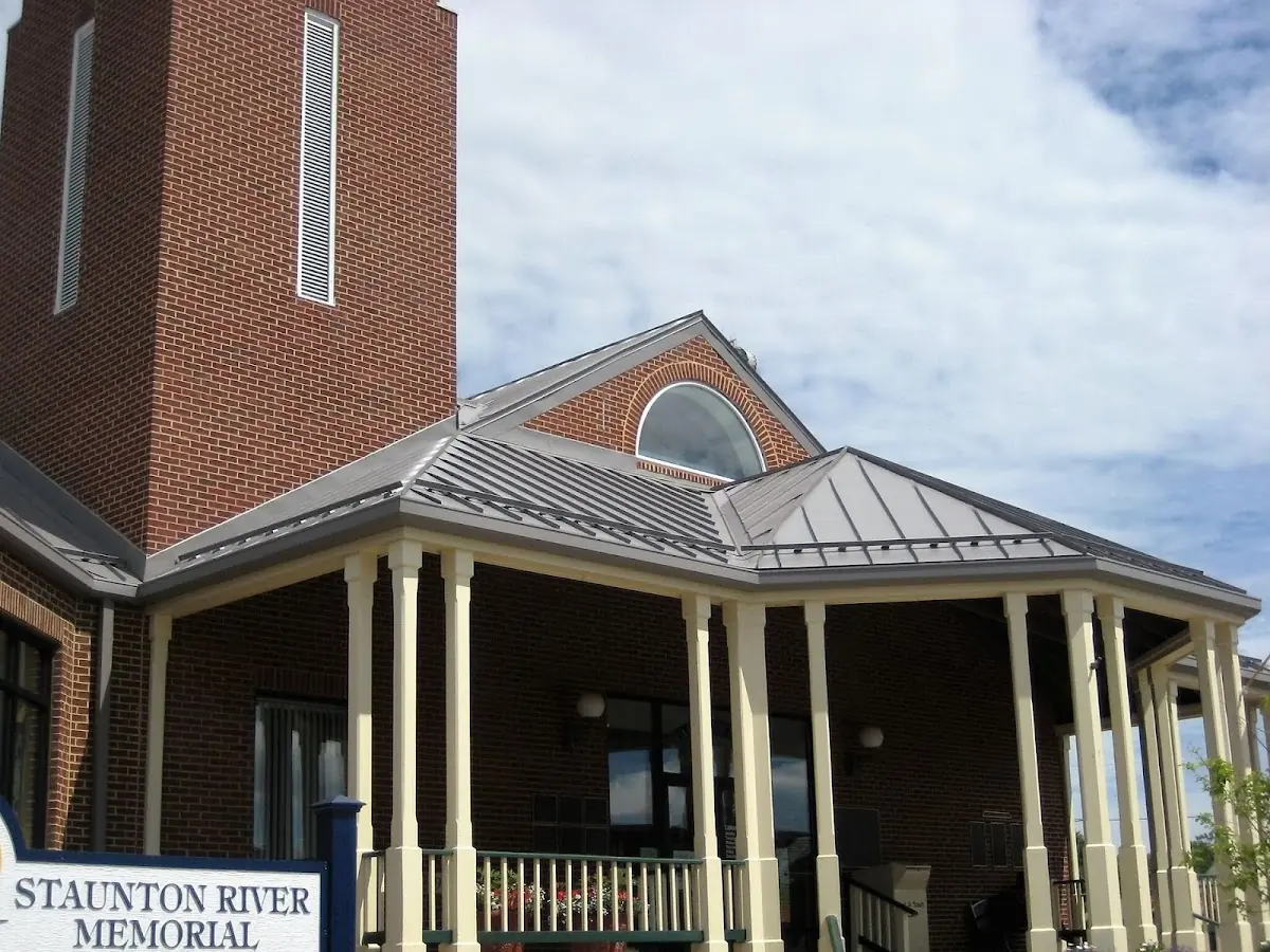Skilled roofing craftsmen working on a residential roof in Saint Francis